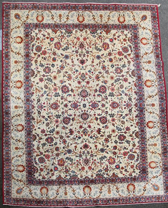 A Kashan ivory ground carpet, 14ft 3in by 10ft 7in.